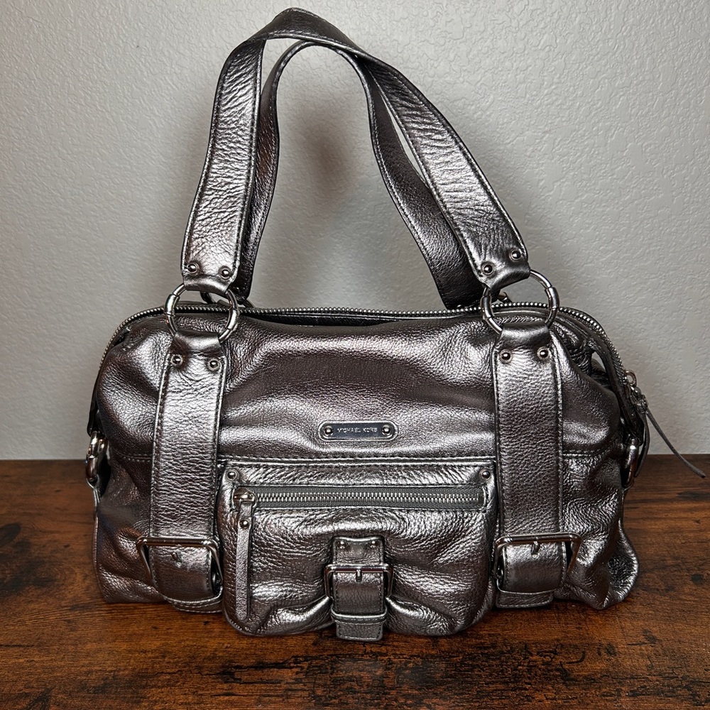 Authentic MK Austin satchel bag. It is made of metallic gray leather.